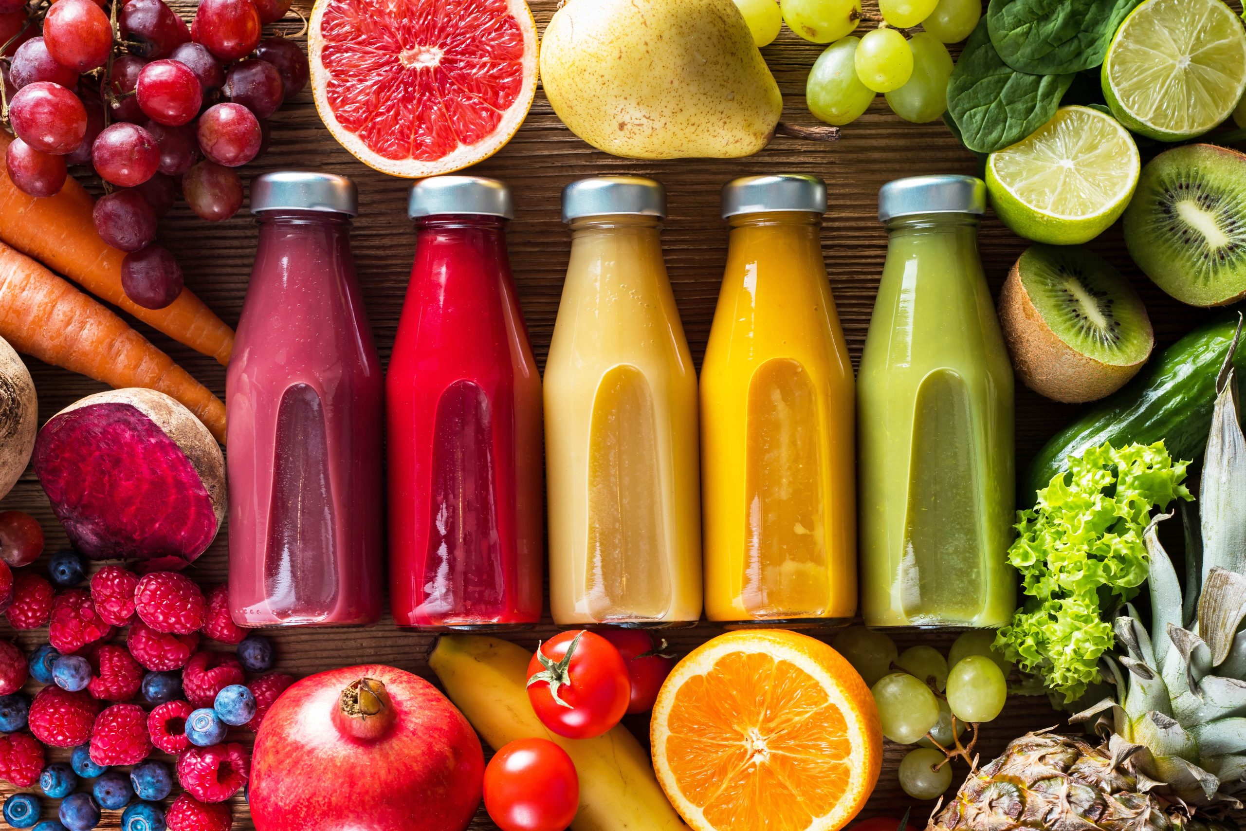 Colorful smoothies in bottles